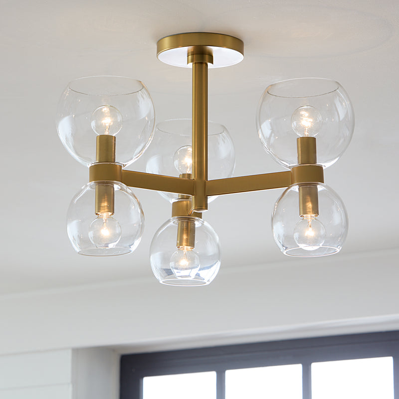 Six Light Semi Flush Mount<br /><span style="color:#4AB0CE;">Entrega: 4-10 dias en USA</span><br /><span style="color:#4AB0CE;font-size:60%;">PREGUNTE POR ENTREGA EN PANAMA</span><br />Collection: Londyn<br />Finish: Burnished Brass with Clear Glass