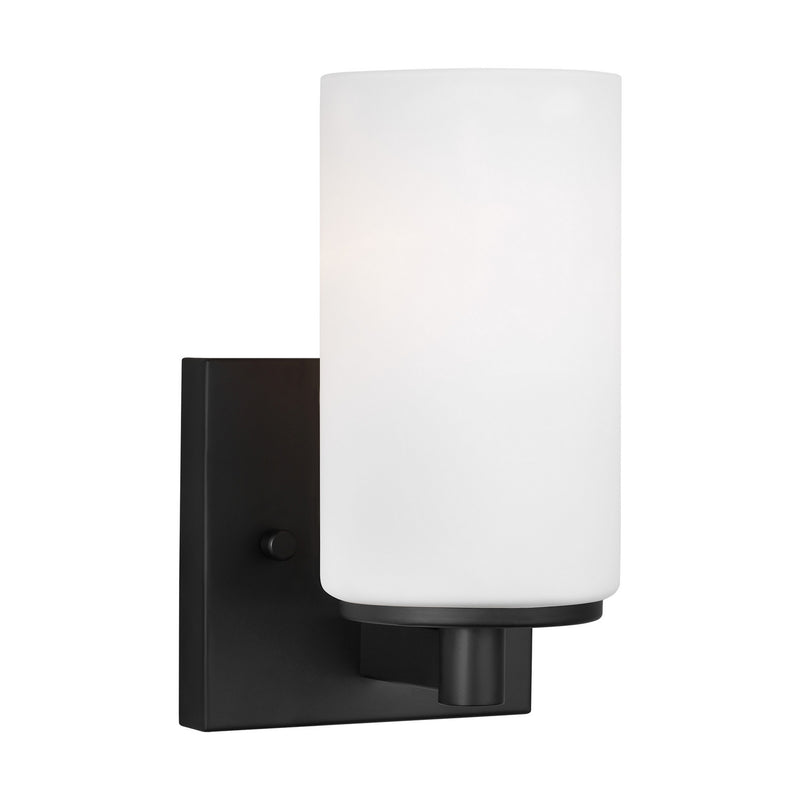 One Light Wall / Bath Sconce<br /><span style="color:#4AB0CE;">Entrega: 4-10 dias en USA</span><br /><span style="color:#4AB0CE;font-size:60%;">PREGUNTE POR ENTREGA EN PANAMA</span><br />Collection: Hettinger<br />Finish: Midnight Black
