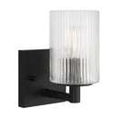 One Light Wall / Bath Sconce<br /><span style="color:#4AB0CE;">Entrega: 4-10 dias en USA</span><br /><span style="color:#4AB0CE;font-size:60%;">PREGUNTE POR ENTREGA EN PANAMA</span><br />Collection: Lando<br />Finish: Midnight Black