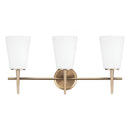 Three Light Wall / Bath<br /><span style="color:#4AB0CE;">Entrega: 4-10 dias en USA</span><br /><span style="color:#4AB0CE;font-size:60%;">PREGUNTE POR ENTREGA EN PANAMA</span><br />Collection: Driscoll<br />Finish: Satin Brass