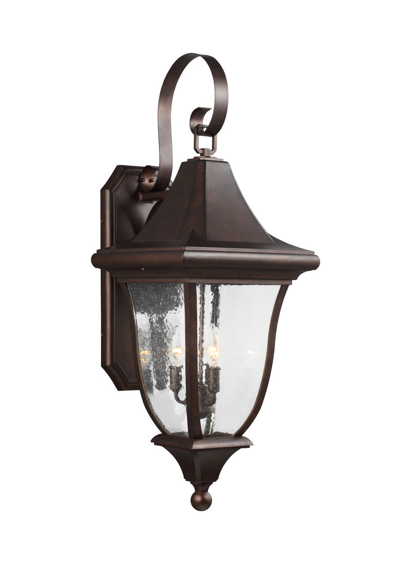 Three Light Outdoor Wall Lantern<br /><span style="color:#4AB0CE;">Entrega: 4-5 semanas en USA</span><br /><span style="color:#4AB0CE;font-size:60%;">PREGUNTE POR ENTREGA EN PANAMA</span><br />Collection: Oakmont<br />Finish: Patina Bronze