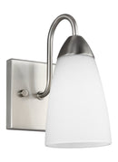 One Light Wall / Bath Sconce<br /><span style="color:#4AB0CE;">Entrega: 4-10 dias en USA</span><br /><span style="color:#4AB0CE;font-size:60%;">PREGUNTE POR ENTREGA EN PANAMA</span><br />Collection: Seville<br />Finish: Brushed Nickel