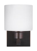 One Light Wall / Bath Sconce<br /><span style="color:#4AB0CE;">Entrega: 4-10 dias en USA</span><br /><span style="color:#4AB0CE;font-size:60%;">PREGUNTE POR ENTREGA EN PANAMA</span><br />Collection: Canfield<br />Finish: Bronze