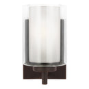 One Light Wall / Bath Sconce<br /><span style="color:#4AB0CE;">Entrega: 3-4 semanas en USA</span><br /><span style="color:#4AB0CE;font-size:60%;">PREGUNTE POR ENTREGA EN PANAMA</span><br />Collection: Elmwood Park<br />Finish: Bronze