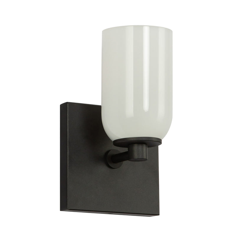 One Light Wall Sconce<br /><span style="color:#4AB0CE;">Entrega: 4-10 dias en USA</span><br /><span style="color:#4AB0CE;font-size:60%;">PREGUNTE POR ENTREGA EN PANAMA</span><br />Collection: Nola<br />Finish: Black/Glossy Opal Glass
