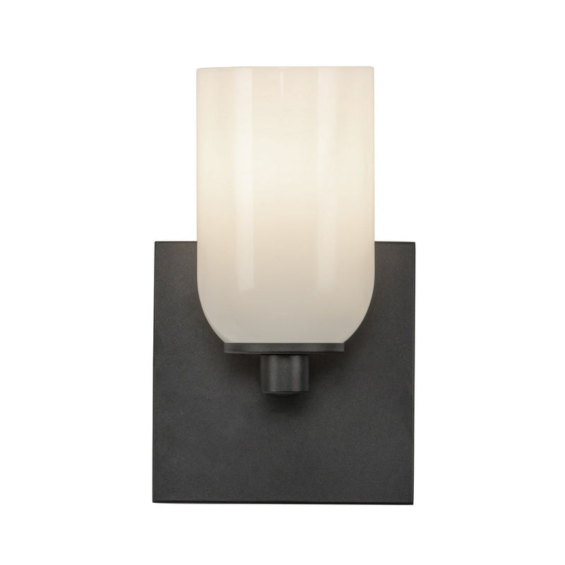One Light Wall Sconce<br /><span style="color:#4AB0CE;">Entrega: 4-10 dias en USA</span><br /><span style="color:#4AB0CE;font-size:60%;">PREGUNTE POR ENTREGA EN PANAMA</span><br />Collection: Nola<br />Finish: Black/Glossy Opal Glass