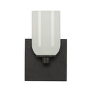 One Light Wall Sconce<br /><span style="color:#4AB0CE;">Entrega: 4-10 dias en USA</span><br /><span style="color:#4AB0CE;font-size:60%;">PREGUNTE POR ENTREGA EN PANAMA</span><br />Collection: Nola<br />Finish: Black/Glossy Opal Glass