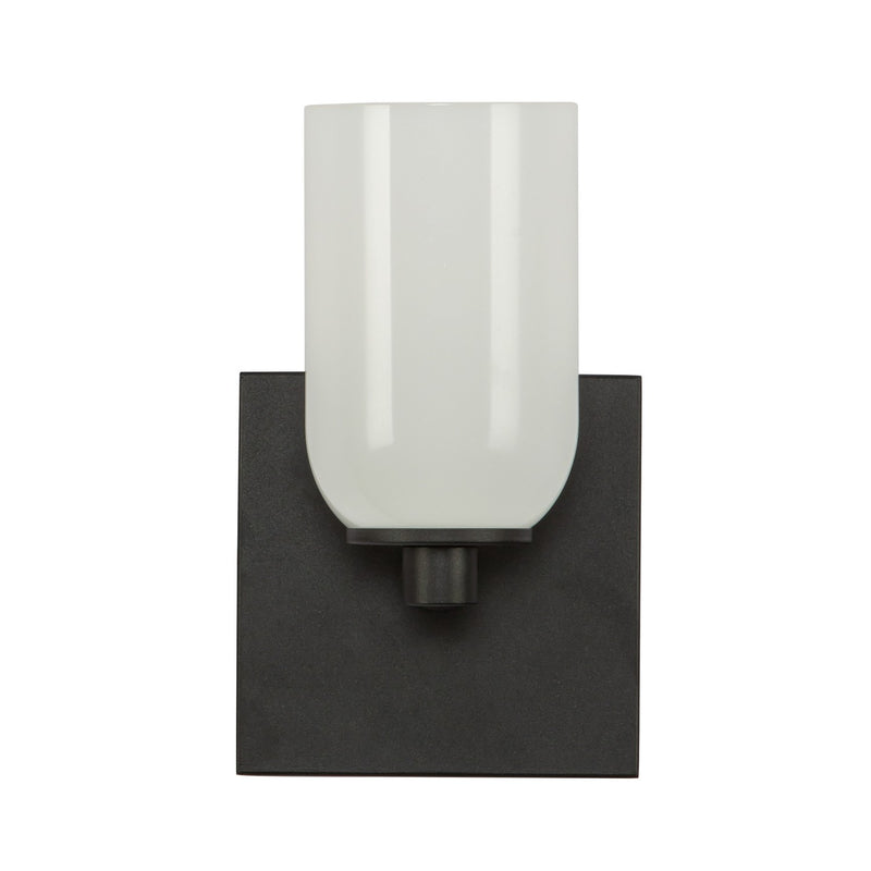 One Light Wall Sconce<br /><span style="color:#4AB0CE;">Entrega: 4-10 dias en USA</span><br /><span style="color:#4AB0CE;font-size:60%;">PREGUNTE POR ENTREGA EN PANAMA</span><br />Collection: Nola<br />Finish: Black/Glossy Opal Glass