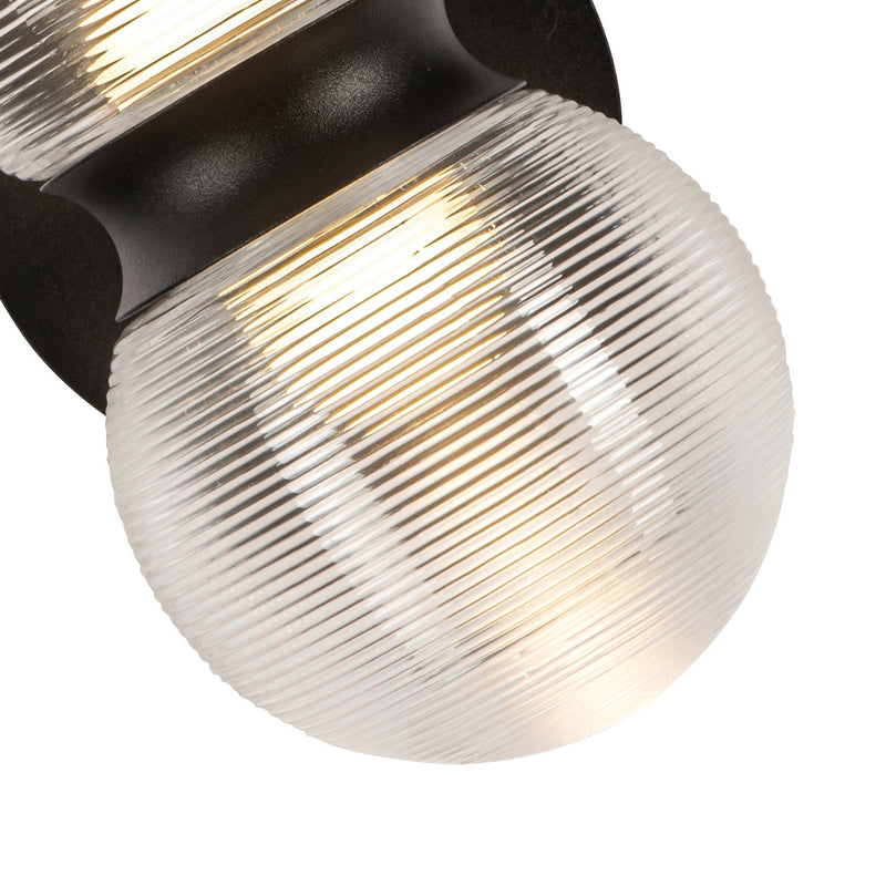 LED Exterior Wall Mount<br /><span style="color:#4AB0CE;">Entrega: 1-2 semanas en USA</span><br /><span style="color:#4AB0CE;font-size:60%;">PREGUNTE POR ENTREGA EN PANAMA</span><br />Collection: Peri<br />Finish: Black/Clear Ribbed Glass