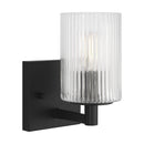One Light Wall / Bath Sconce<br /><span style="color:#4AB0CE;">Entrega: 4-10 dias en USA</span><br /><span style="color:#4AB0CE;font-size:60%;">PREGUNTE POR ENTREGA EN PANAMA</span><br />Collection: Lando<br />Finish: Midnight Black