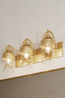 Three Light Vanity<br /><span style="color:#4AB0CE;">Entrega: 4-10 dias en USA</span><br /><span style="color:#4AB0CE;font-size:60%;">PREGUNTE POR ENTREGA EN PANAMA</span><br />Collection: Ravik<br />Finish: Legacy Brass