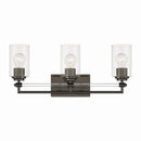 Three Light Vanity<br /><span style="color:#4AB0CE;">Entrega: 4-10 dias en USA</span><br /><span style="color:#4AB0CE;font-size:60%;">PREGUNTE POR ENTREGA EN PANAMA</span><br />Collection: Binsly<br />Finish: Rustic Gun Metal